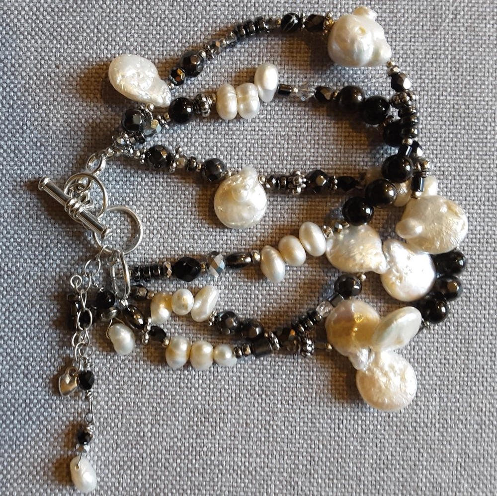 Handmade mother of pearl/freshwater pearl bracelet.